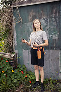 Sarah at her Allotment eating plums