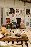 Wallpaper samples, vases, dried flowers and copies of the Celtic calendar fill the Wylding studio