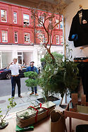 Jake and John dress the window at 38 Chiltern Street