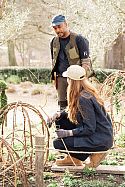 Wooden boards are placed on the garden beds to create walkways