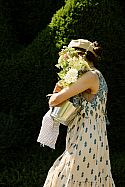 Tasha carrying a bouquet of flowers in a Niwaki Galvanised Bucket
